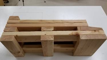 A wooden box

Description generated with high confidence